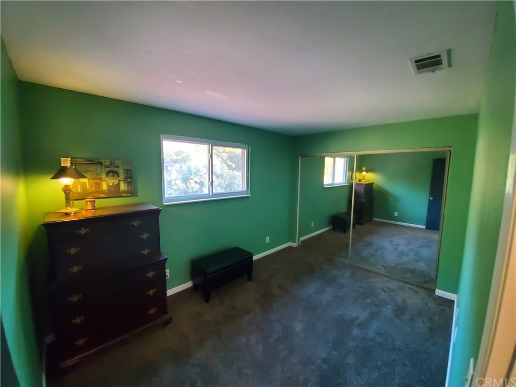 8260 Weirick Road Corona, CA 92883 - Photo 18 of 40 a room with furniture and a window