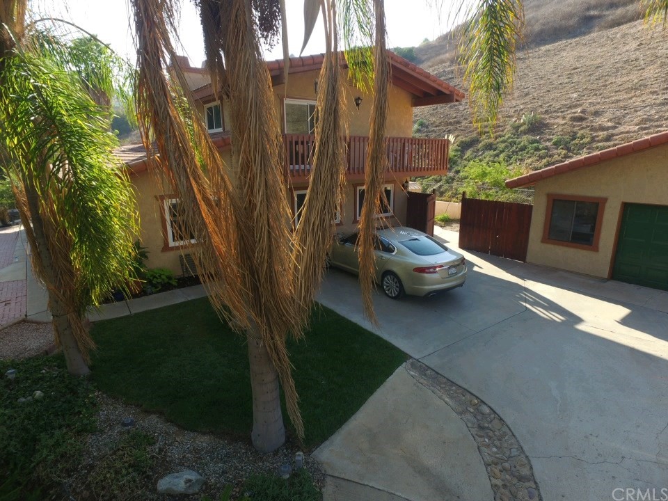8260 Weirick Road Corona, CA 92883 - Photo 24 of 40 a couple of cars parked in front of a house