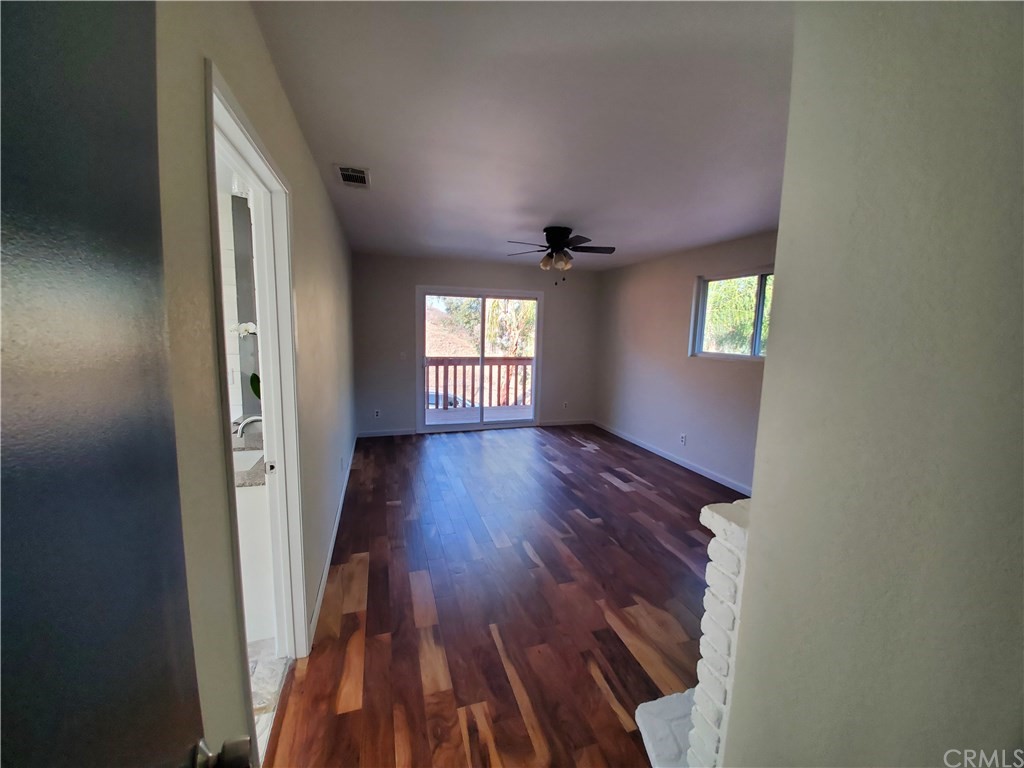 8260 Weirick Road Corona, CA 92883 - Photo 5 of 40 wooden floor in an empty room with a window