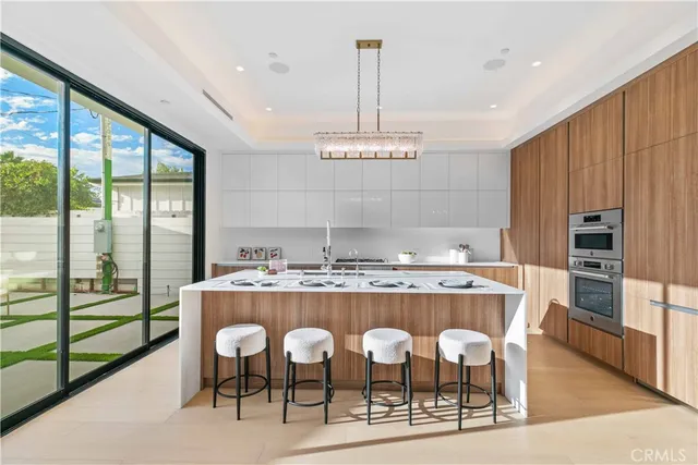 a kitchen that has a lot of cabinets in it