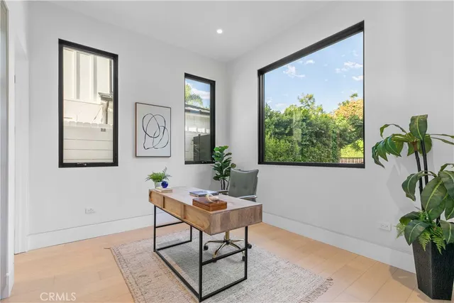 a kitchen with a table chairs and a stove