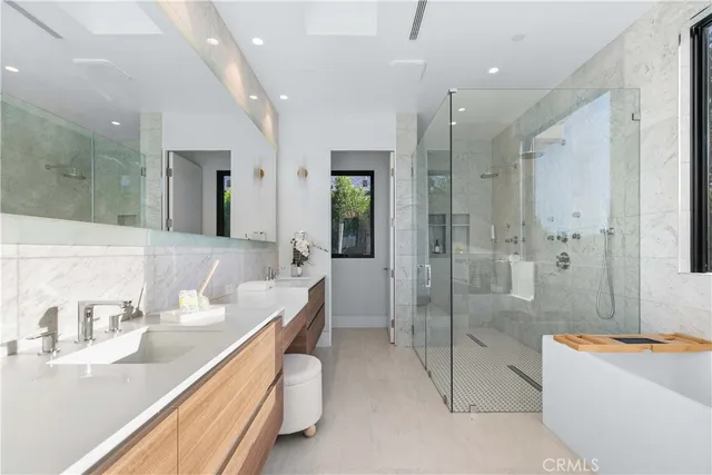 a kitchen with stainless steel appliances kitchen island granite countertop a sink and cabinets