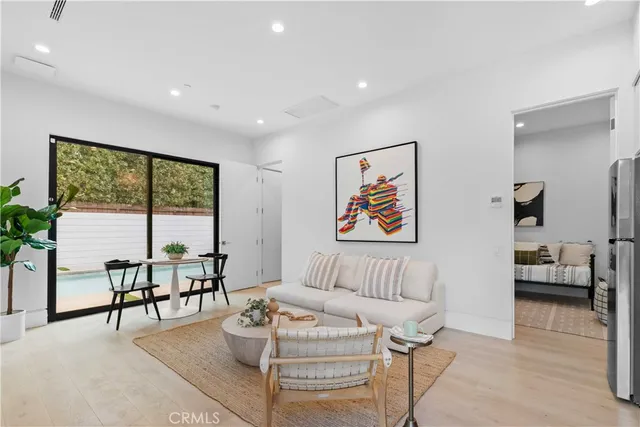 a living room with furniture and a table