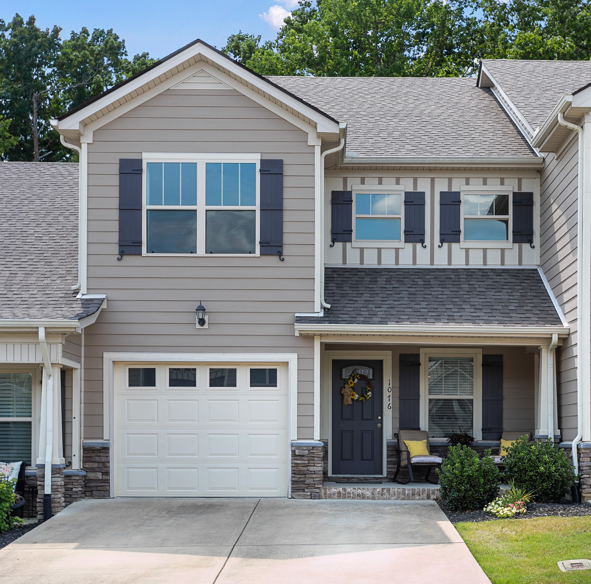 a front view of a house with garden