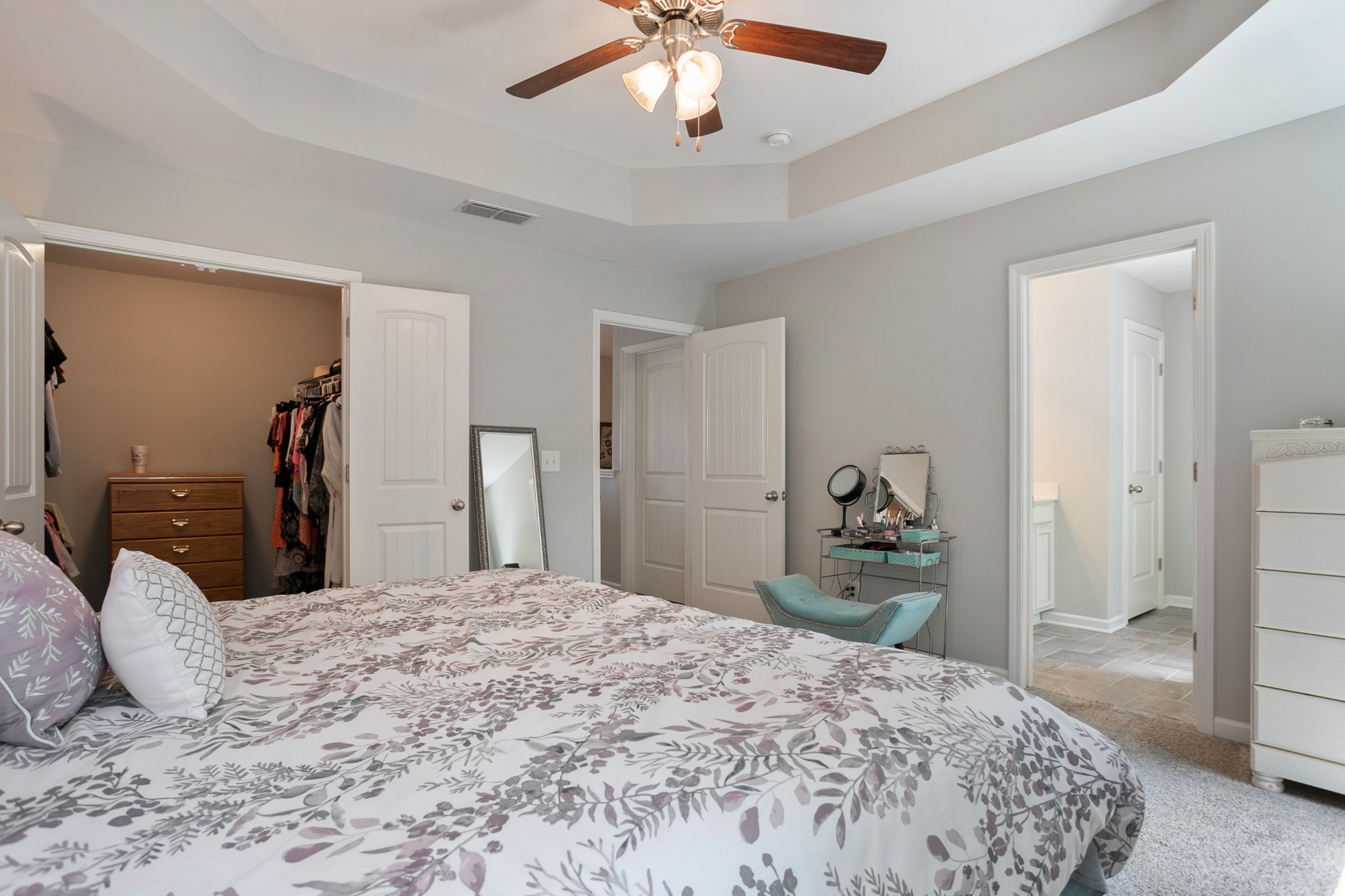 1076 Neeleys Bend East Spring Hill, TN 37174 - Photo 17 of 27 a bedroom with a bed and a chandelier