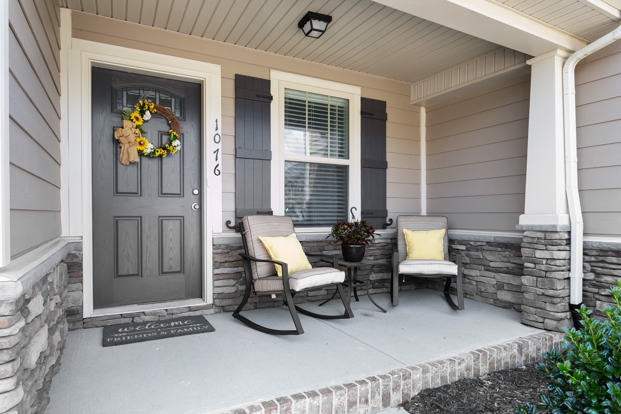 1076 Neeleys Bend East Spring Hill, TN 37174 - Photo 3 of 27 a balcony with furniture and a potted plant