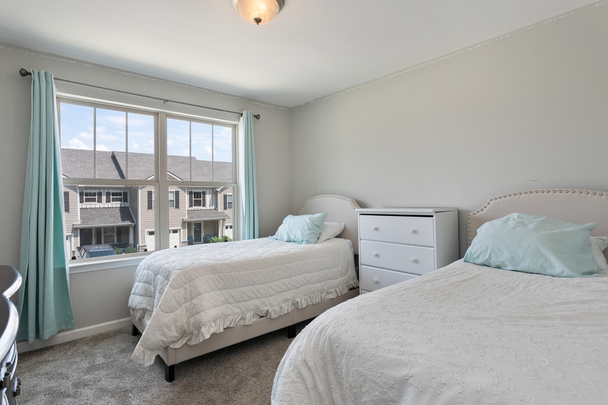 1076 Neeleys Bend East Spring Hill, TN 37174 - Photo 21 of 27 a bedroom with two beds and a large window