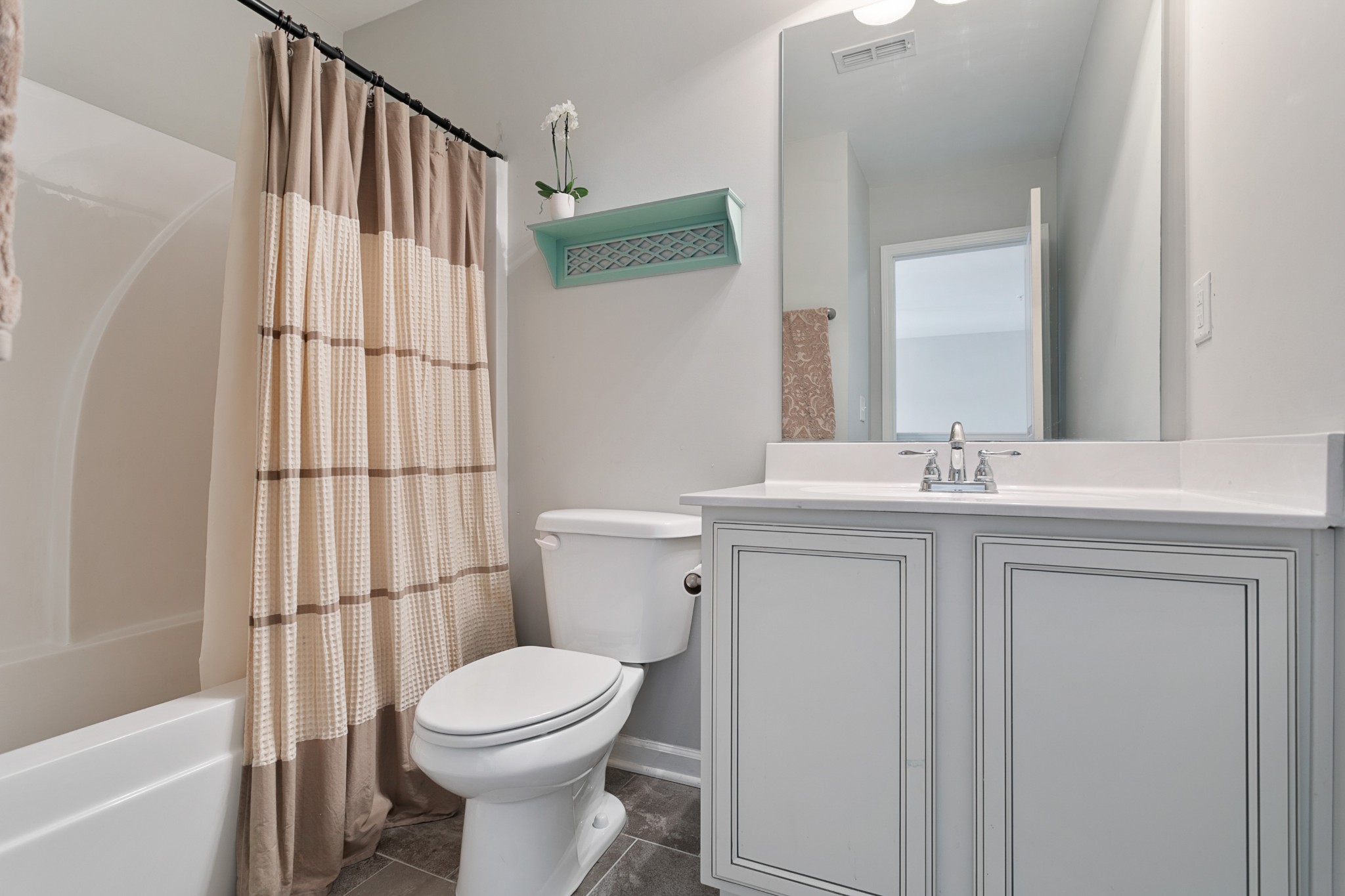 1076 Neeleys Bend East Spring Hill, TN 37174 - Photo 22 of 27 a bathroom with a sink a toilet and shower