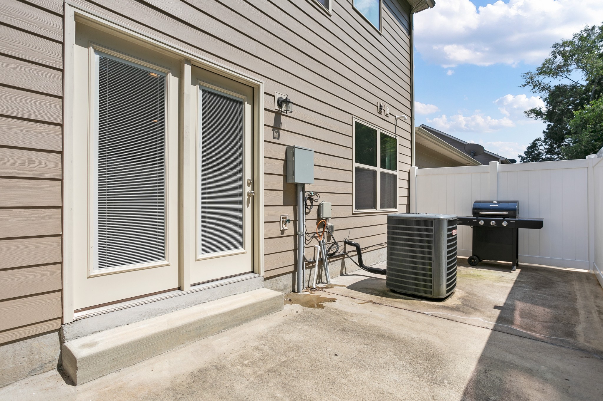 1076 Neeleys Bend East Spring Hill, TN 37174 - Photo 23 of 27 a backyard of a house with barbeque and wooden fence