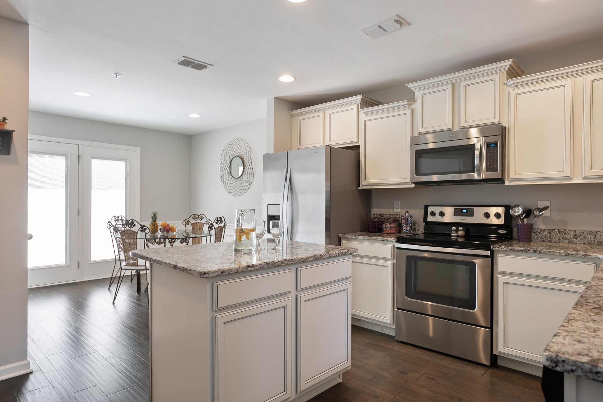 1076 Neeleys Bend East Spring Hill, TN 37174 - Photo 7 of 27 a kitchen with a sink stove and cabinets