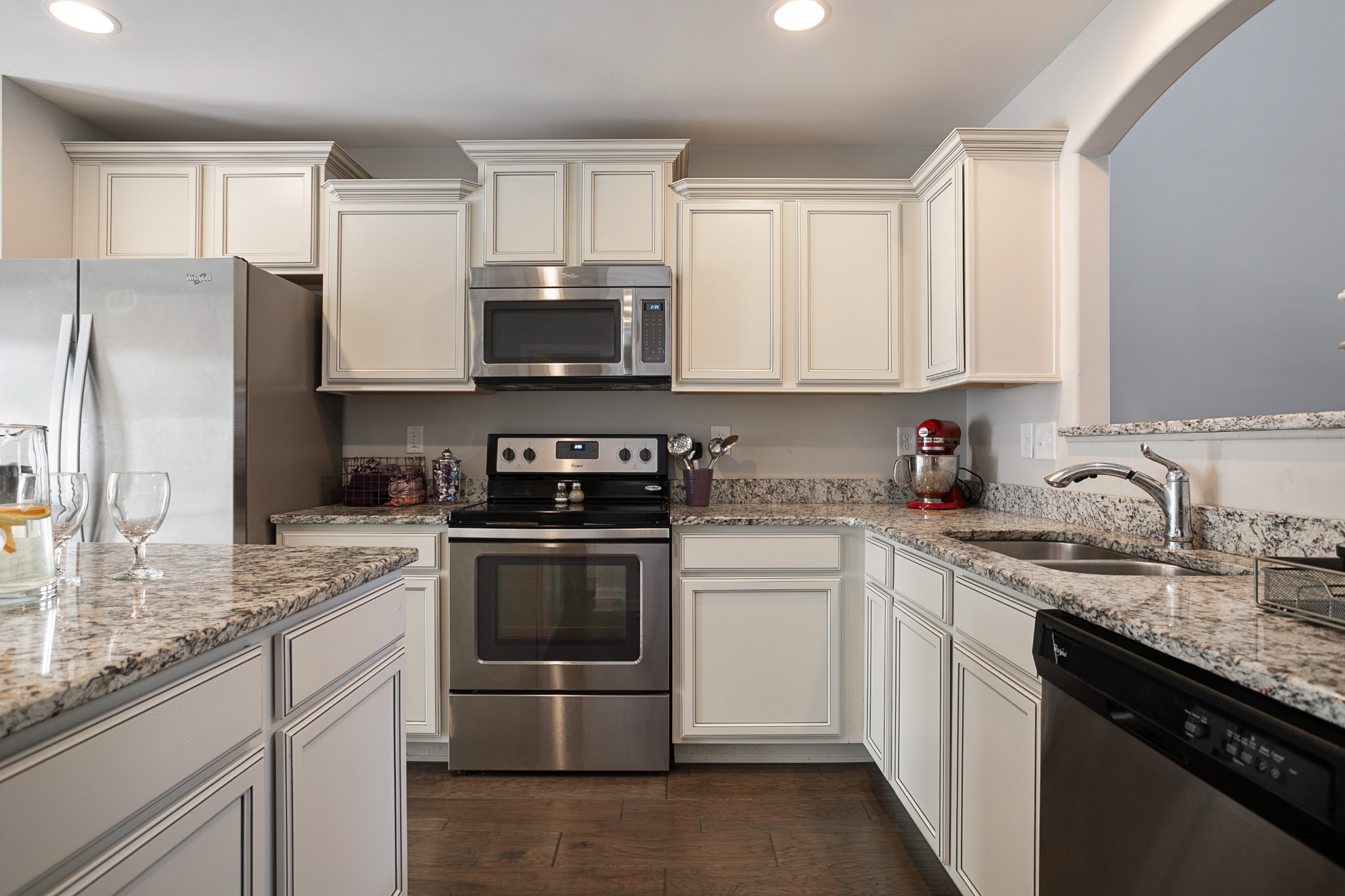 1076 Neeleys Bend East Spring Hill, TN 37174 - Photo 8 of 27 a kitchen with stainless steel appliances granite countertop a sink stove refrigerator and cabinets