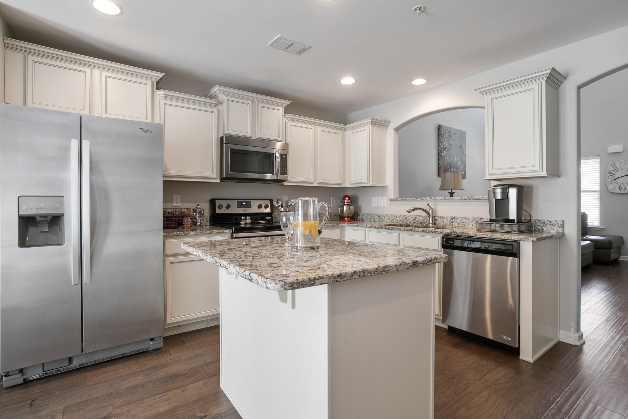 1076 Neeleys Bend East Spring Hill, TN 37174 - Photo 9 of 27 a kitchen with stainless steel appliances granite countertop a stove a sink and a refrigerator