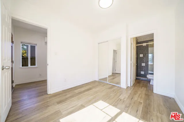 a view of hallway with wooden floor