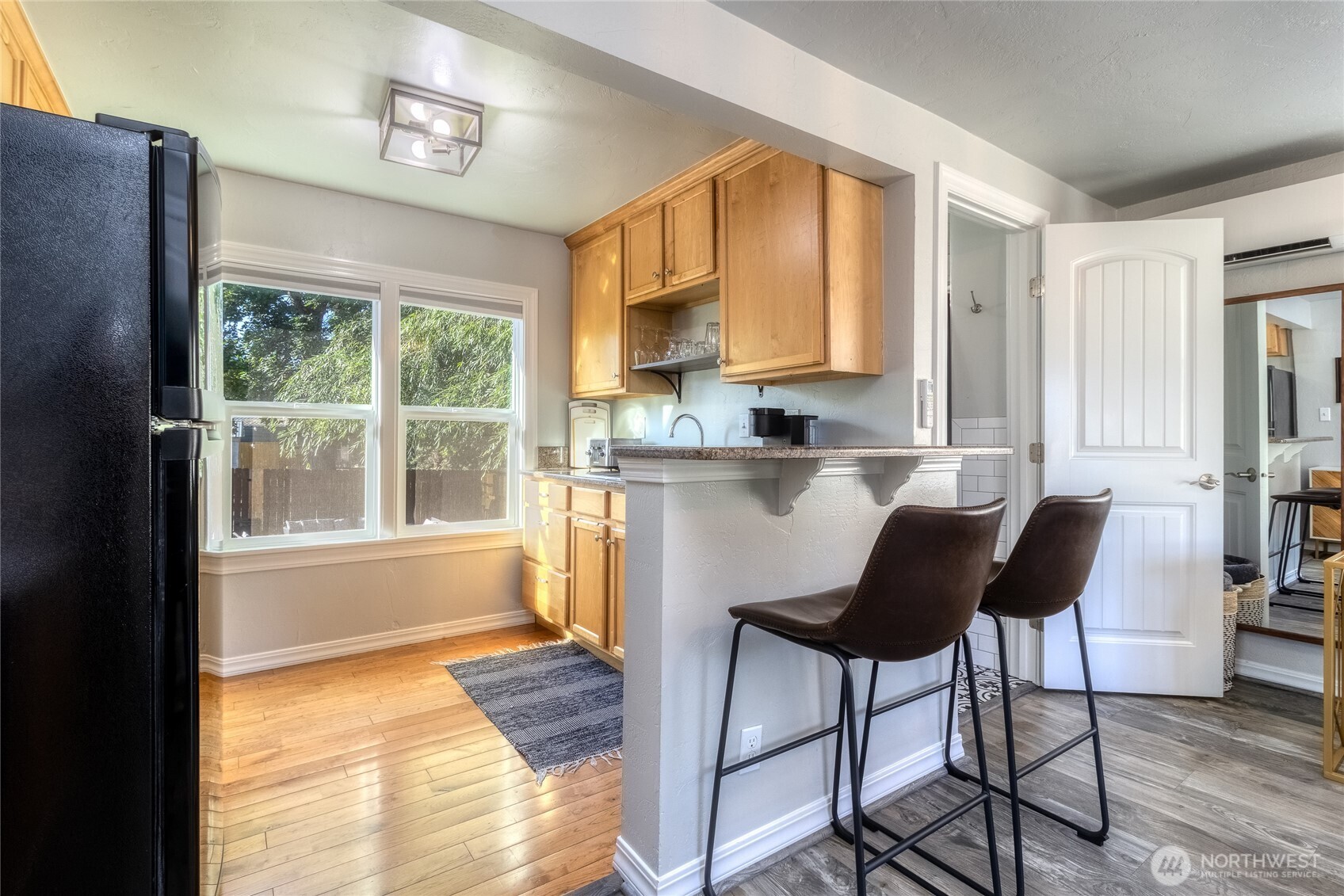 15 Eagan Street Walla Walla, WA 99362 - Photo 5 of 20 a kitchen with granite countertop a stove a sink and a refrigerator