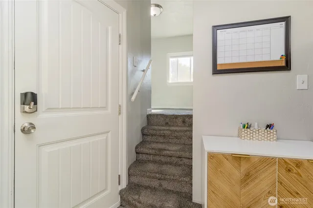 a view of a hallway with front door