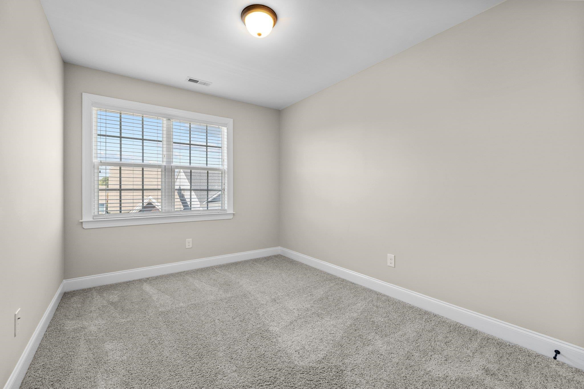 905 Shoofly Path Apex, NC 27502 - Photo 15 of 31 an empty room with windows
