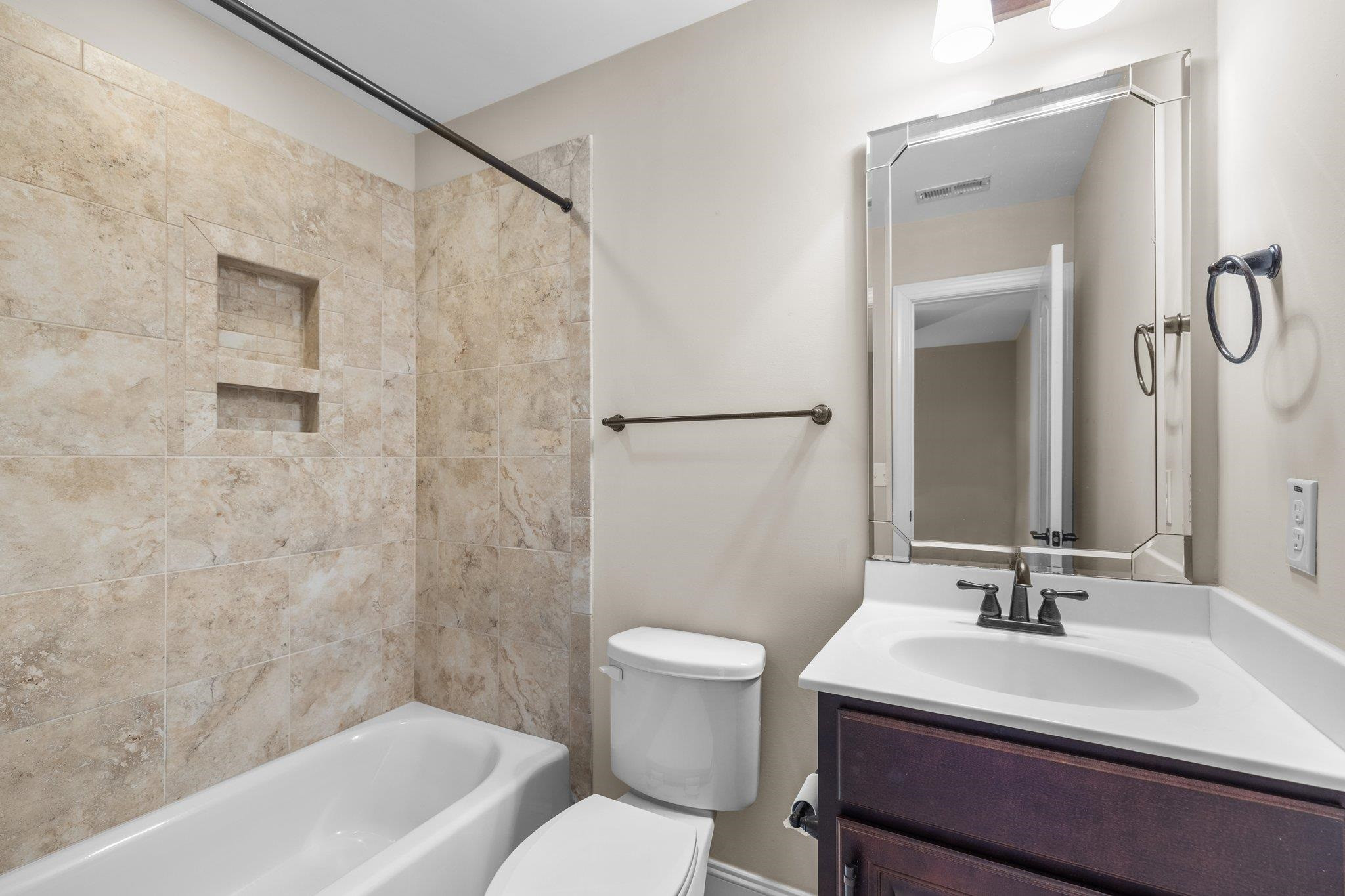 905 Shoofly Path Apex, NC 27502 - Photo 17 of 31 a bathroom with a sink toilet and shower