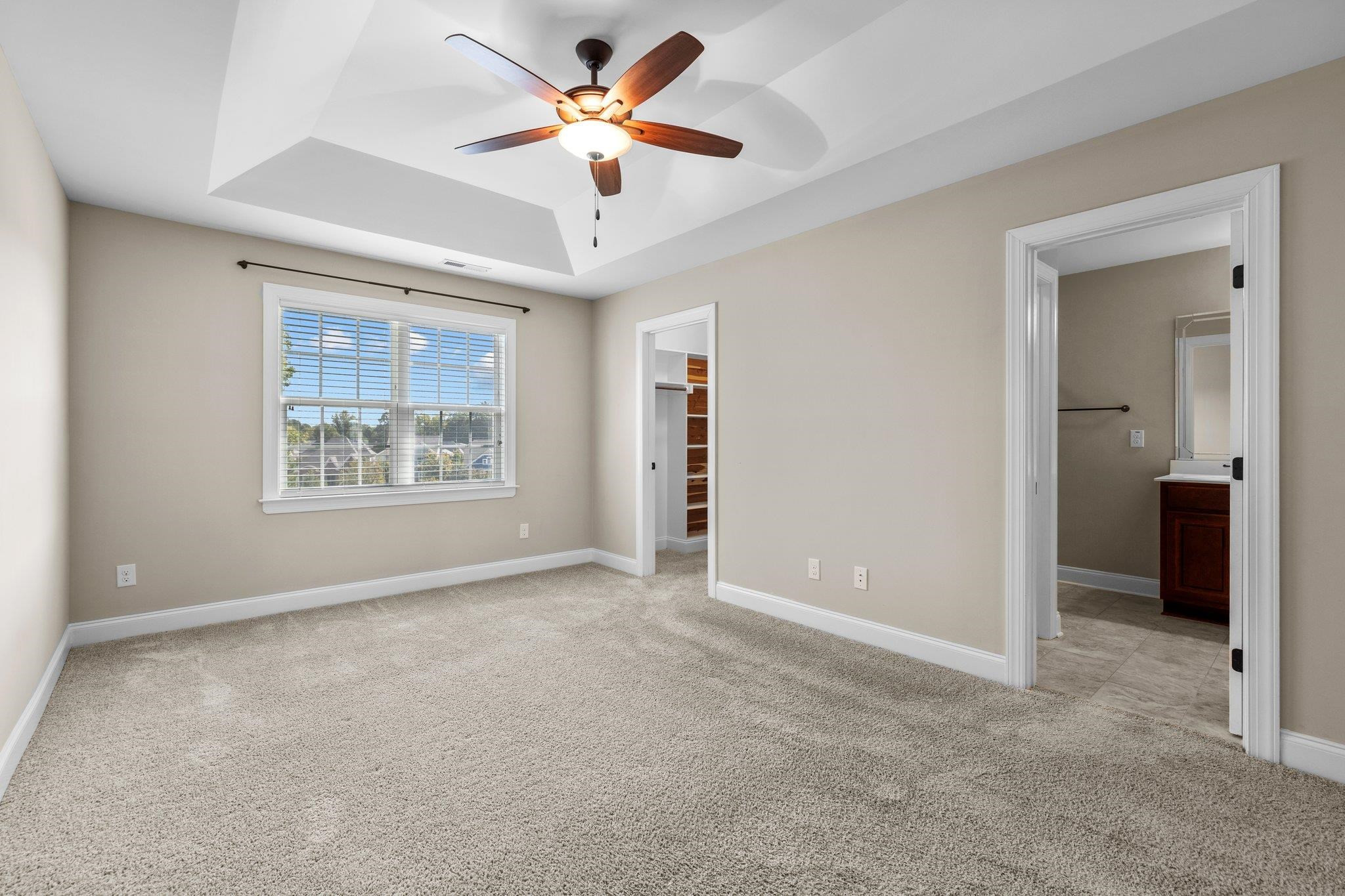 905 Shoofly Path Apex, NC 27502 - Photo 19 of 31 an empty room with fan and windows