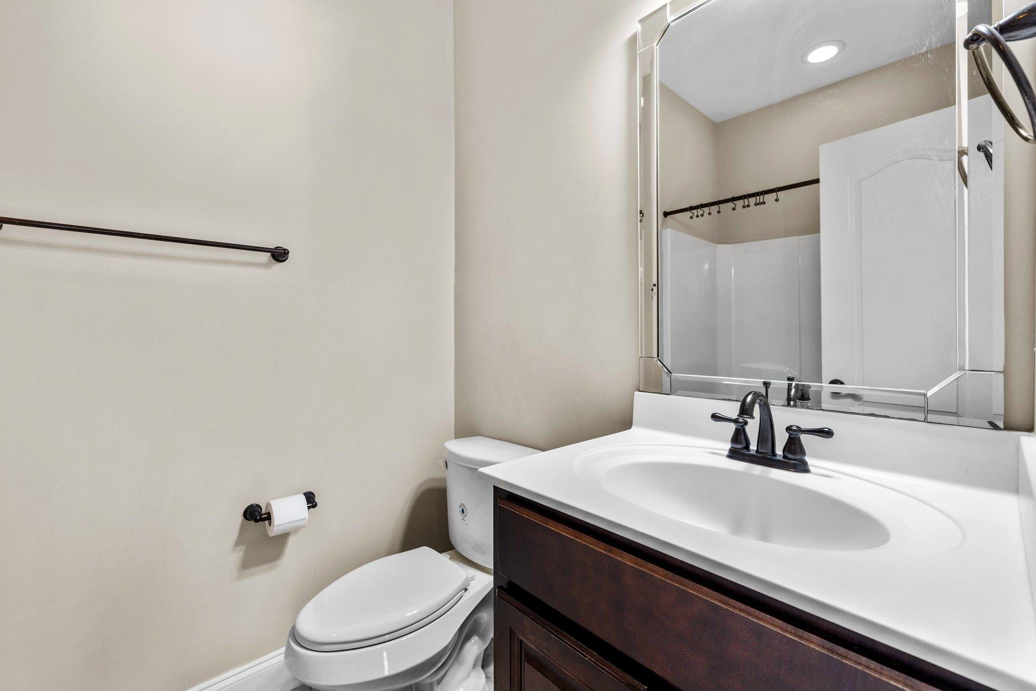 905 Shoofly Path Apex, NC 27502 - Photo 22 of 31 a bathroom with a sink toilet and shower
