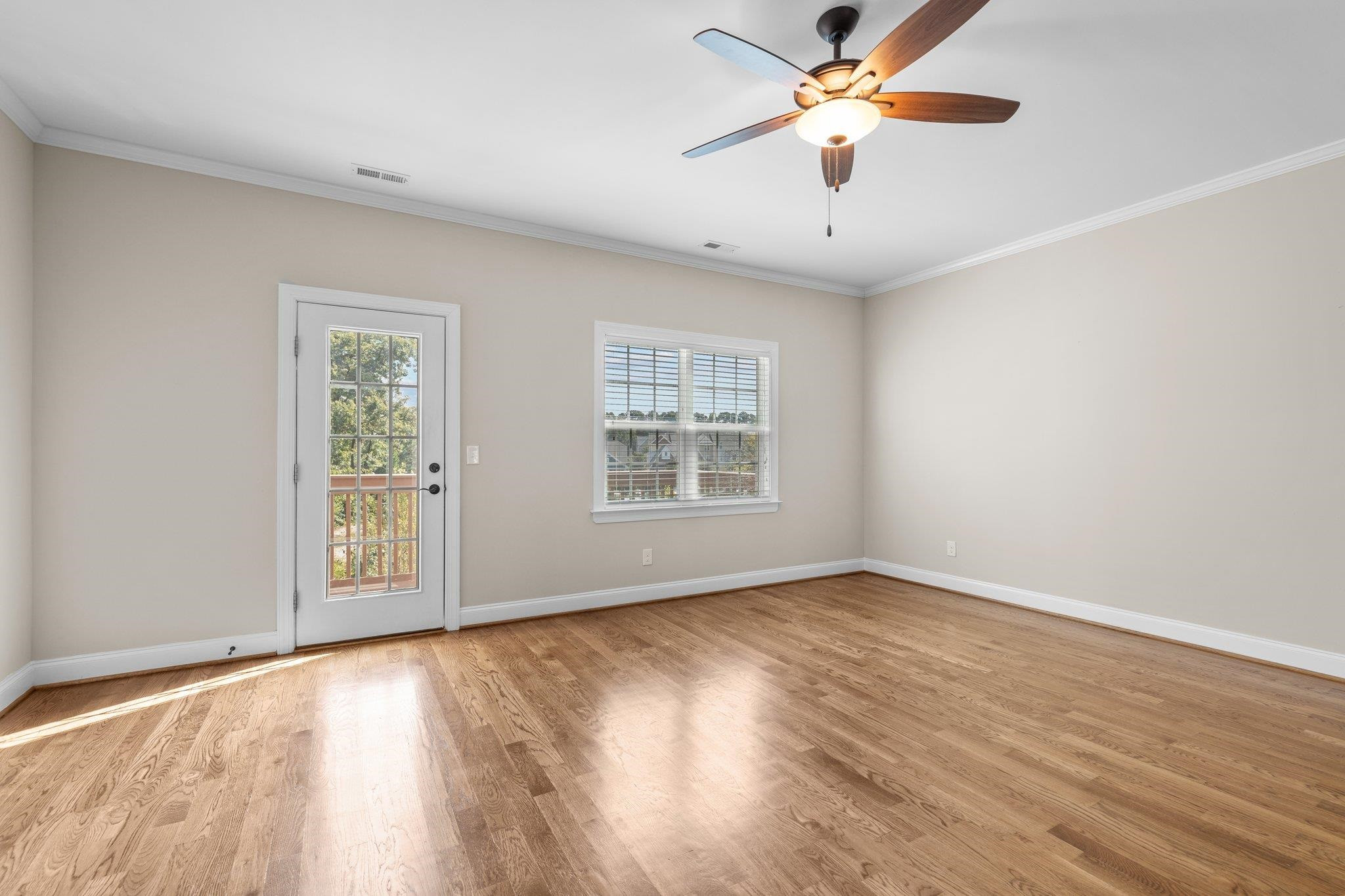 905 Shoofly Path Apex, NC 27502 - Photo 25 of 31 a view of an empty room with window and wooden floor