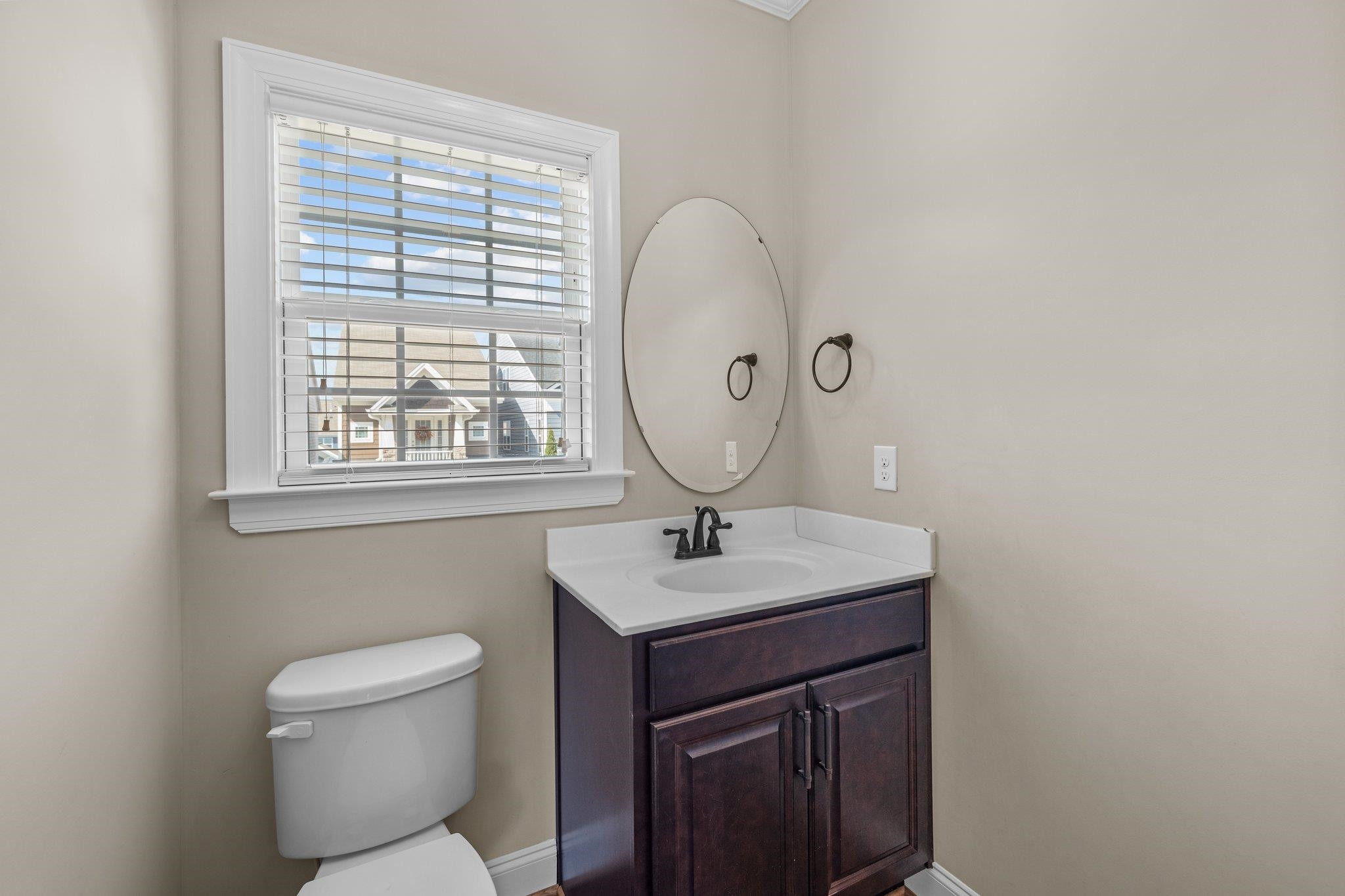 905 Shoofly Path Apex, NC 27502 - Photo 8 of 31 a bathroom with a toilet sink and mirror