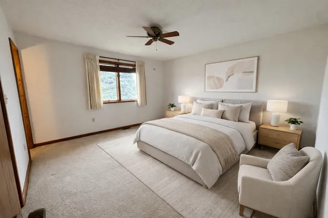 a bedroom with bed and window