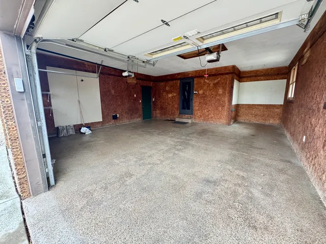 a view of a room with wooden walls