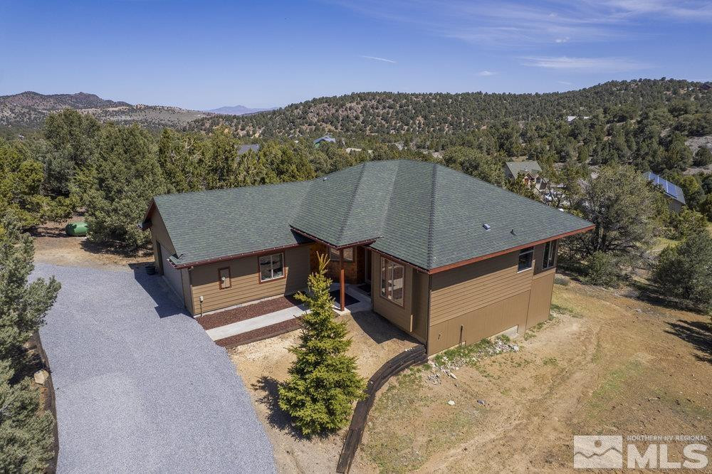 21860 Bowie Road Reno, NV 89521 - Photo 1 of 24 a view of a terrace with a forest