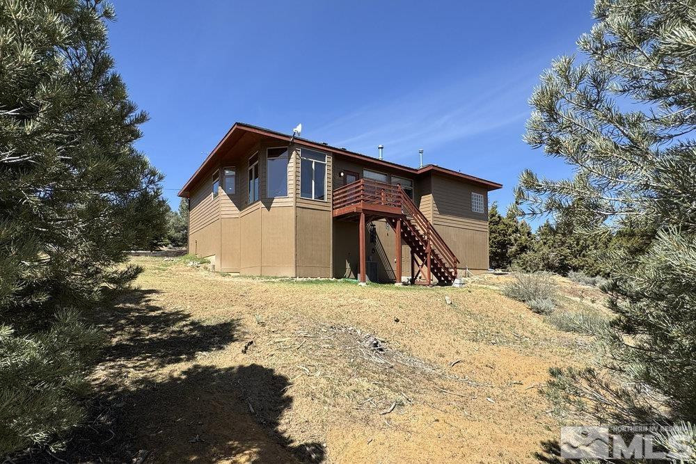 21860 Bowie Road Reno, NV 89521 - Photo 23 of 24 a house with trees in the background