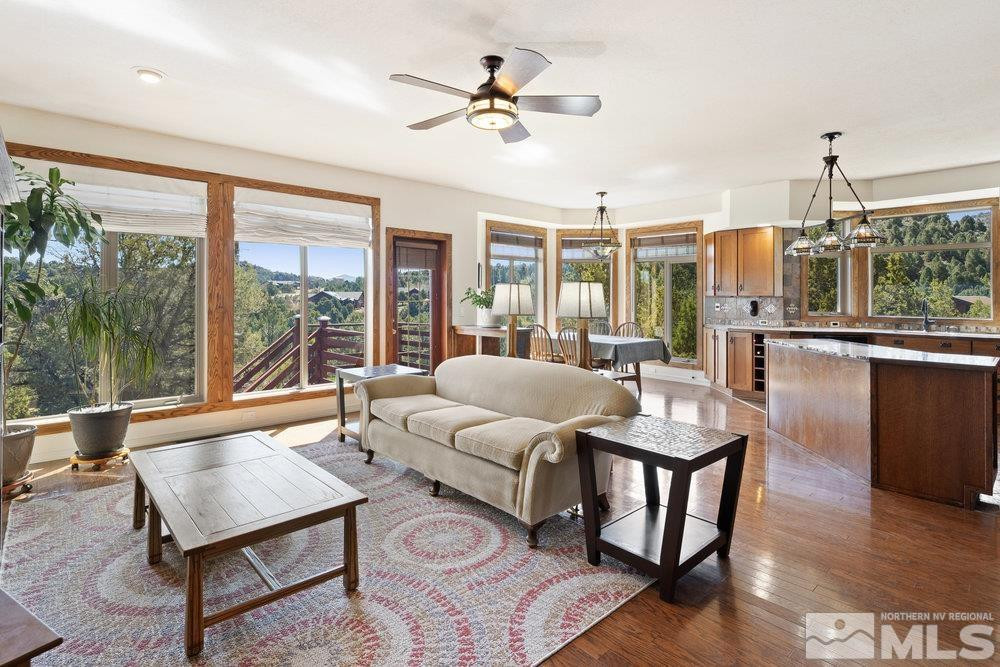 21860 Bowie Road Reno, NV 89521 - Photo 5 of 24 a living room with furniture a table and a large window