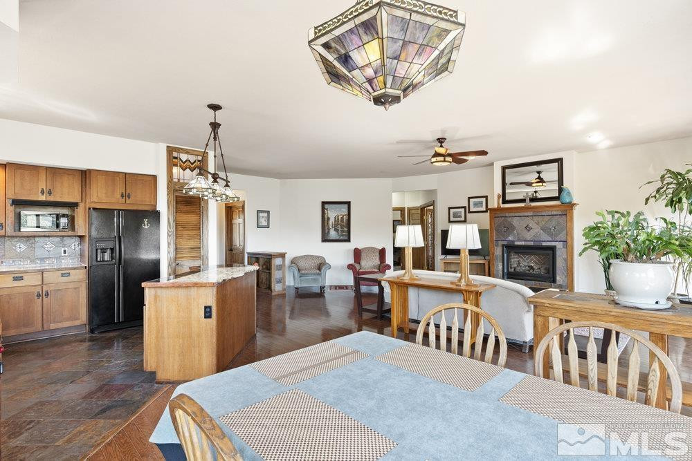 21860 Bowie Road Reno, NV 89521 - Photo 7 of 24 a living room with furniture and a fireplace