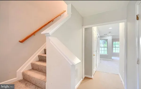 a kitchen with stainless steel appliances granite countertop a refrigerator oven a sink dishwasher and a oven with wooden floor