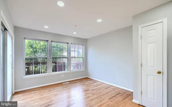 a large kitchen with a large counter top appliances and cabinets