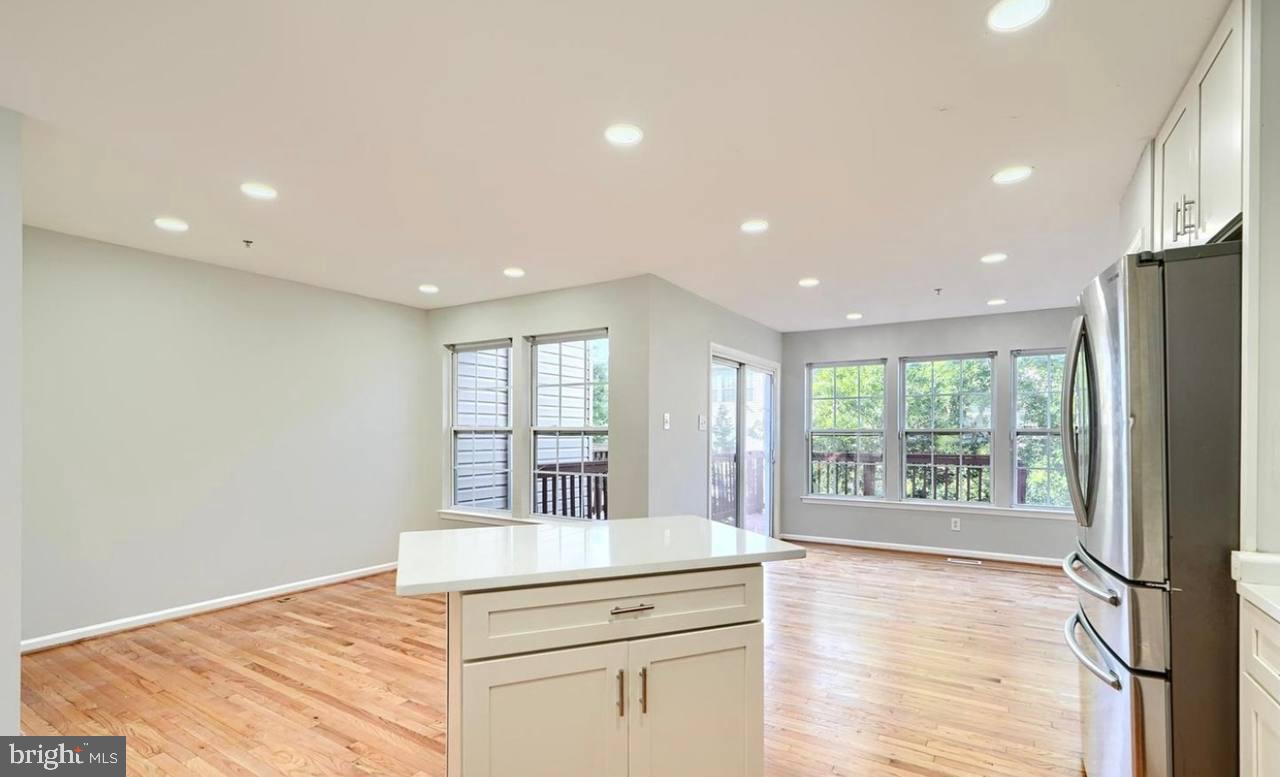 9863 Decatur Road Middle River, MD 21220 - Photo 21 of 33 a kitchen with stainless steel appliances granite countertop a refrigerator and a stove top oven