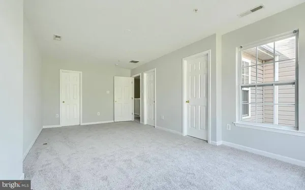 a view of storage and utility room with racks on the wall