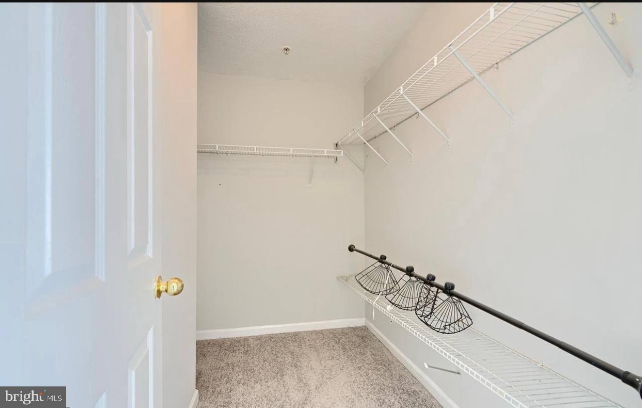 9863 Decatur Road Middle River, MD 21220 - Photo 27 of 33 a view of storage and utility room with racks on the wall