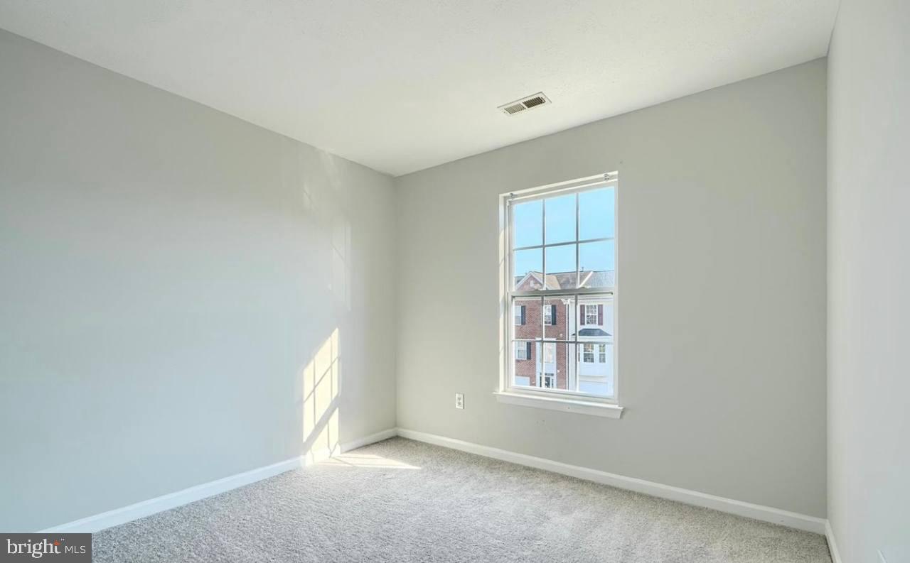9863 Decatur Road Middle River, MD 21220 - Photo 28 of 33 an empty room with windows