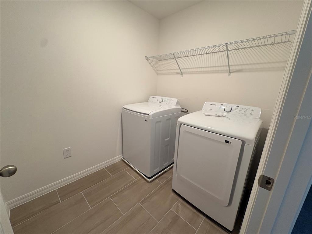 2529 Starry Point St. Cloud, FL 34769 - Photo 12 of 21 a utility room with dryer and washer