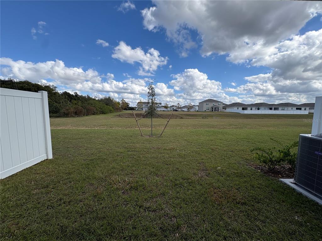 2529 Starry Point St. Cloud, FL 34769 - Photo 19 of 21 a view of a lake in middle of the house