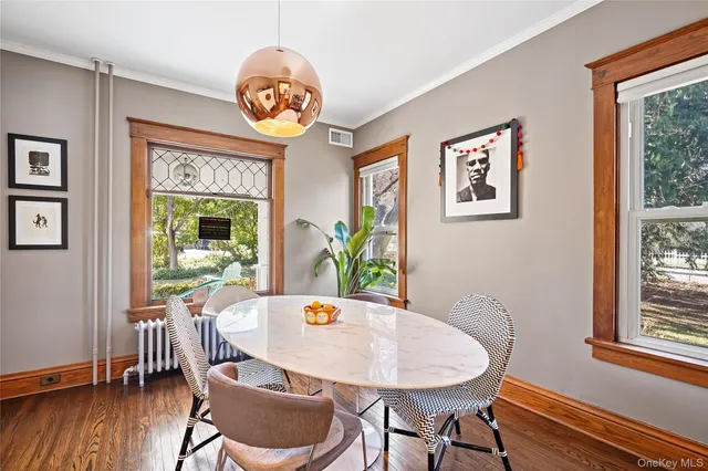 a dining room with furniture and window