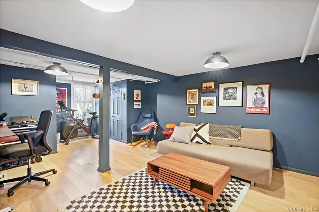 a bedroom with furniture and a book shelf