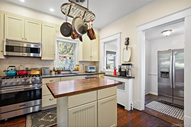a kitchen with a stove and a microwave