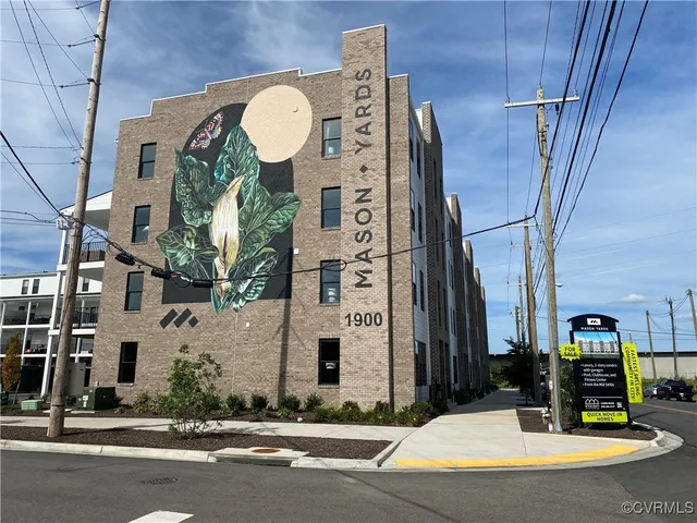 a view of a building with a street