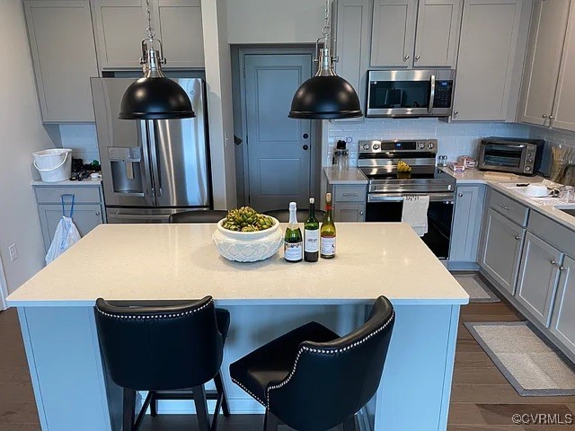 1900 Roseneath Road, Unit 4B Richmond, VA 23230 - Photo 8 of 10 a kitchen with stainless steel appliances kitchen island granite countertop a sink a stove and chairs