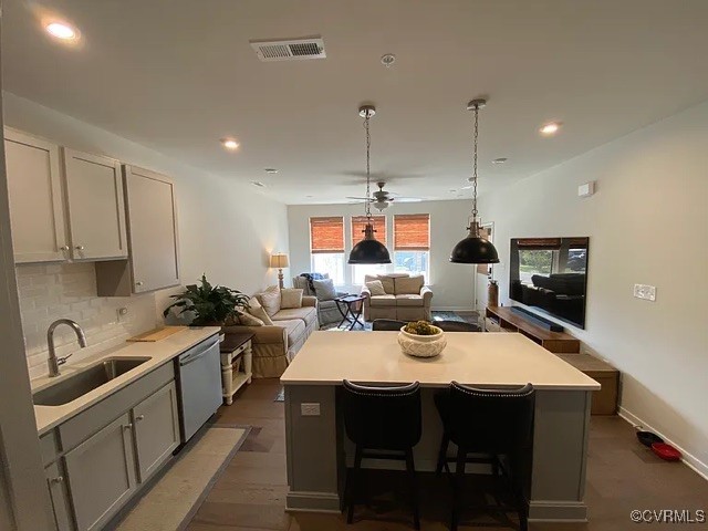 1900 Roseneath Road, Unit 4B Richmond, VA 23230 - Photo 9 of 10 a kitchen with a sink a stove a refrigerator and chairs