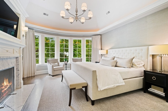 519 Willow Road Winnetka, IL 60093 - Photo 22 of 44 a bed room with a bed and a fireplace
