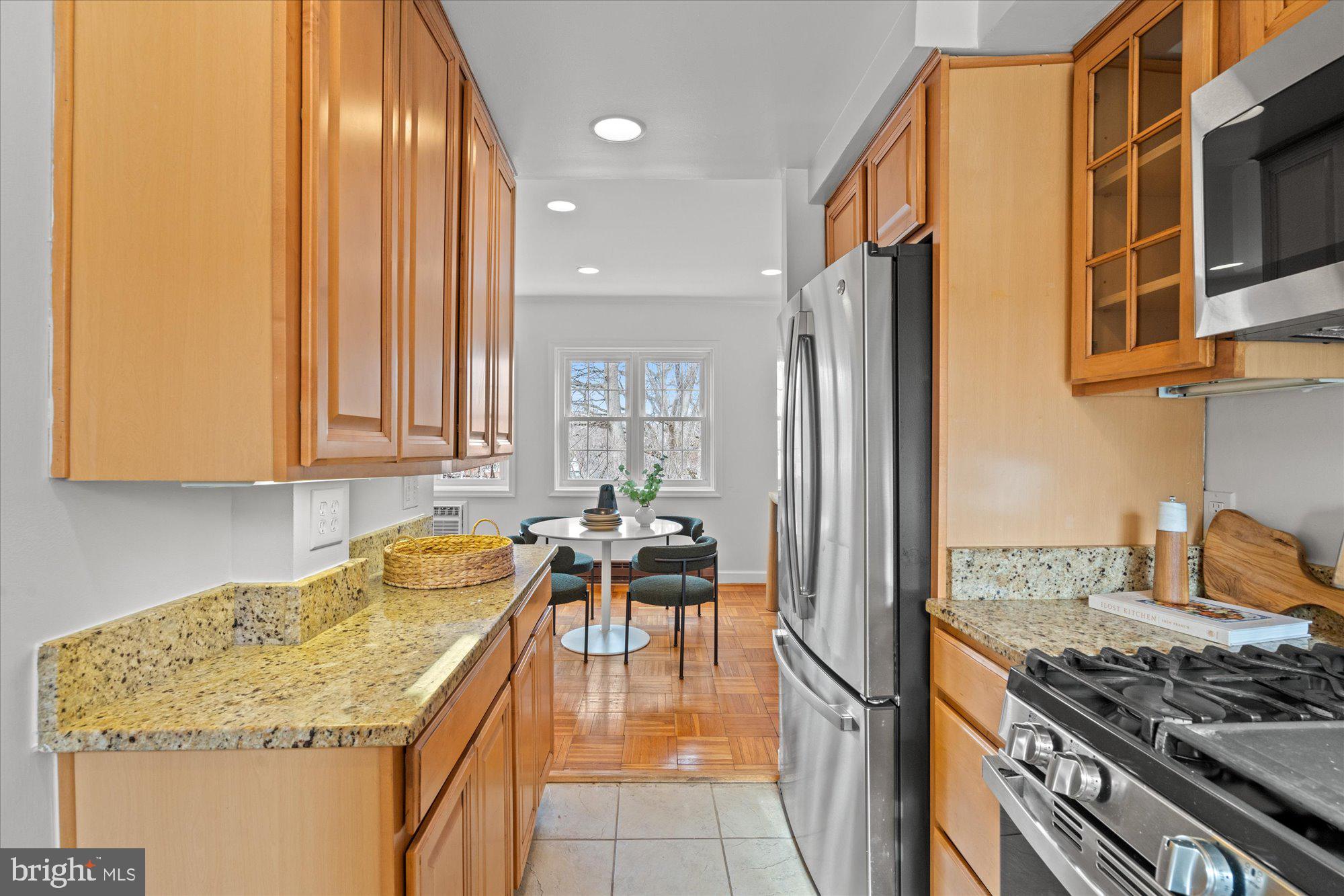 3206 Gunston Road Alexandria, VA 22302 - Photo 11 of 25 a kitchen with stainless steel appliances granite countertop a stove and a refrigerator