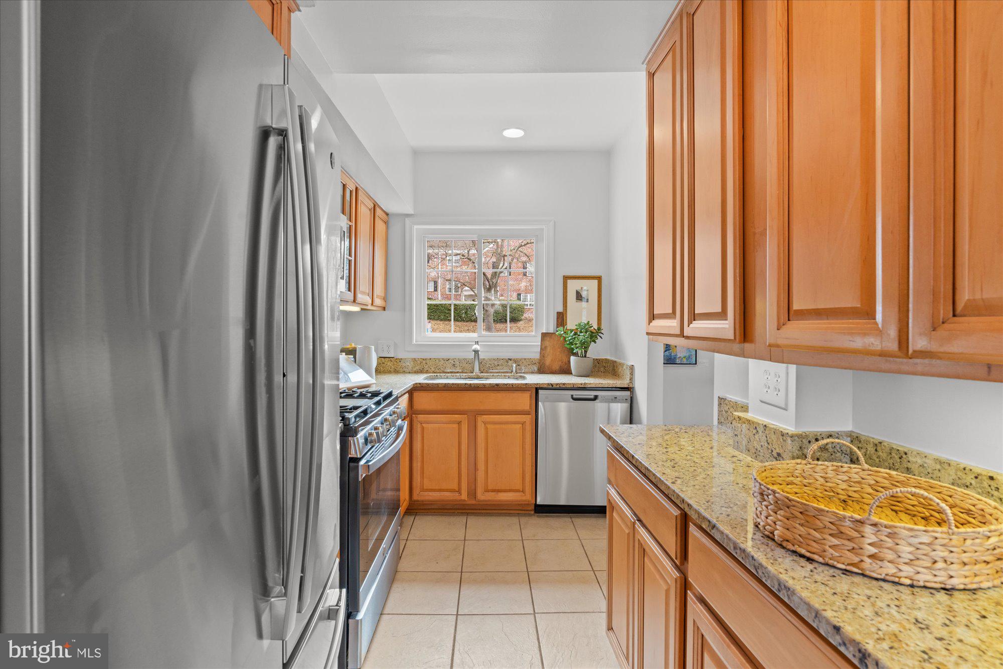 3206 Gunston Road Alexandria, VA 22302 - Photo 12 of 25 a kitchen with a sink and cabinets