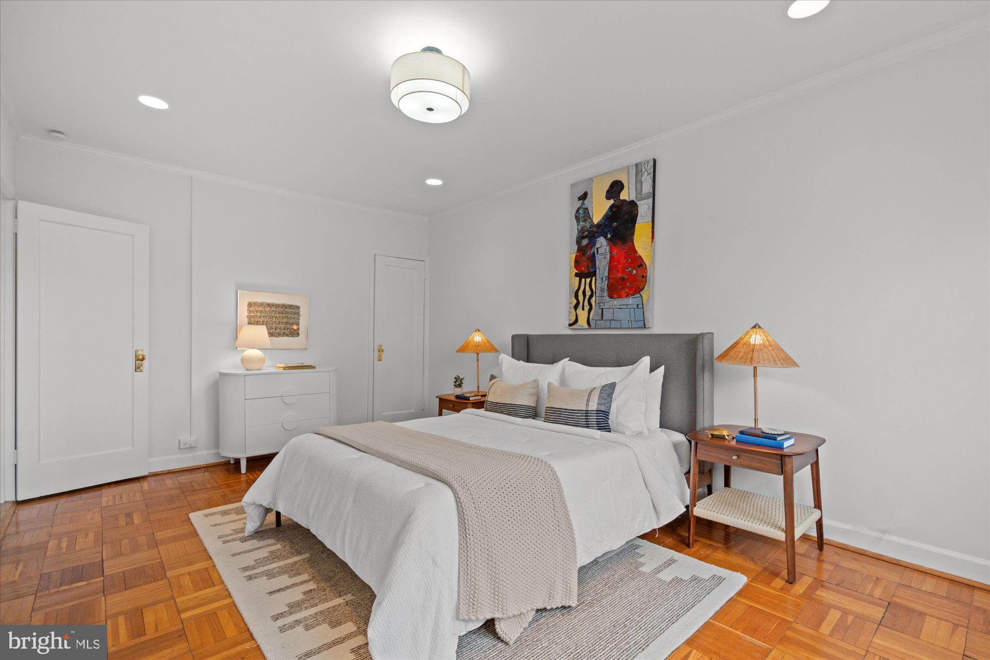 3206 Gunston Road Alexandria, VA 22302 - Photo 16 of 25 a bedroom with a bed and a painting on the wall
