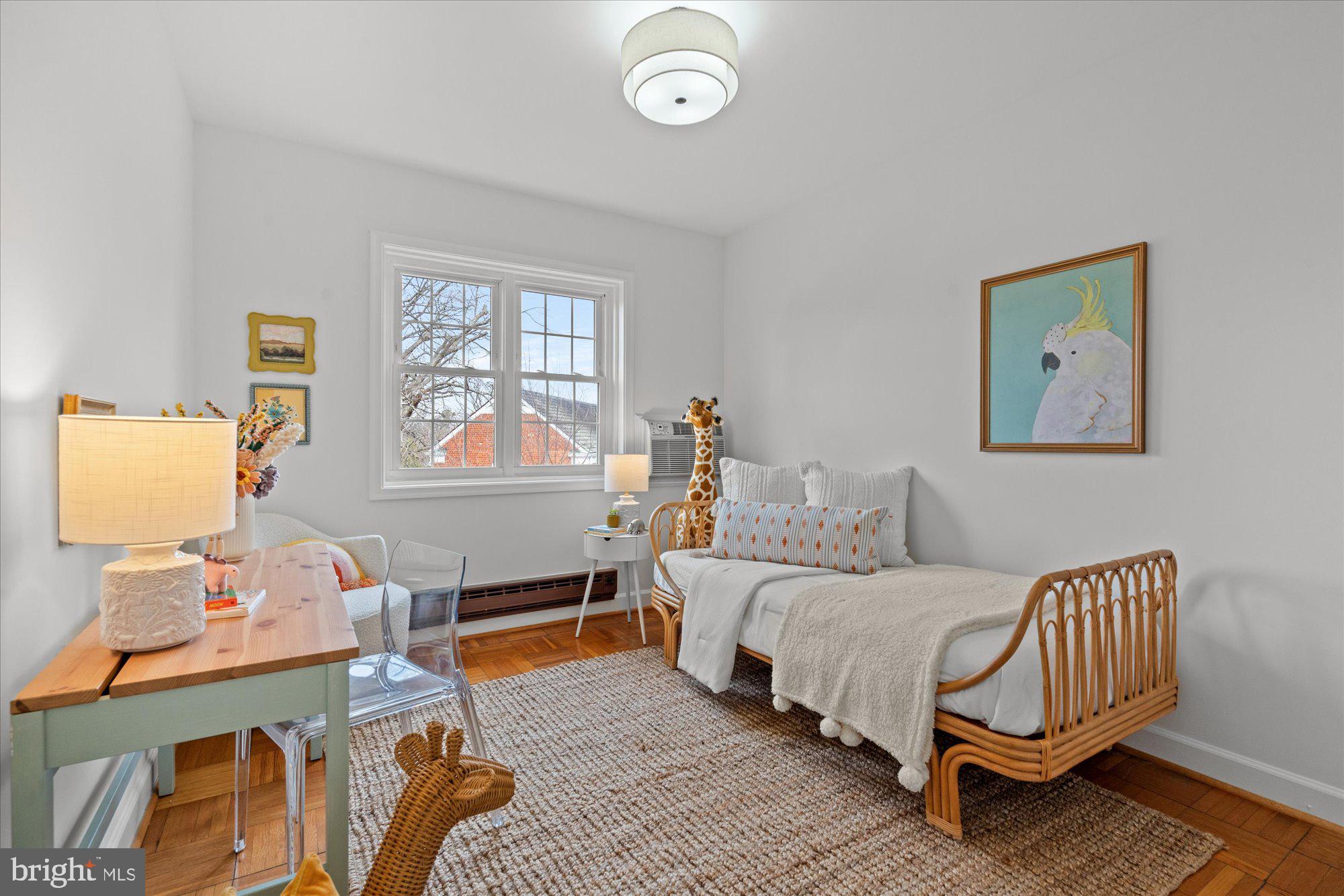 3206 Gunston Road Alexandria, VA 22302 - Photo 18 of 25 a bedroom with a bed and wooden floor